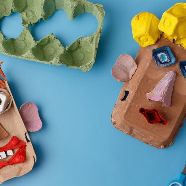 Handmade face puppets made from egg cartons.