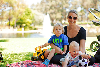 Family sitting in a City park