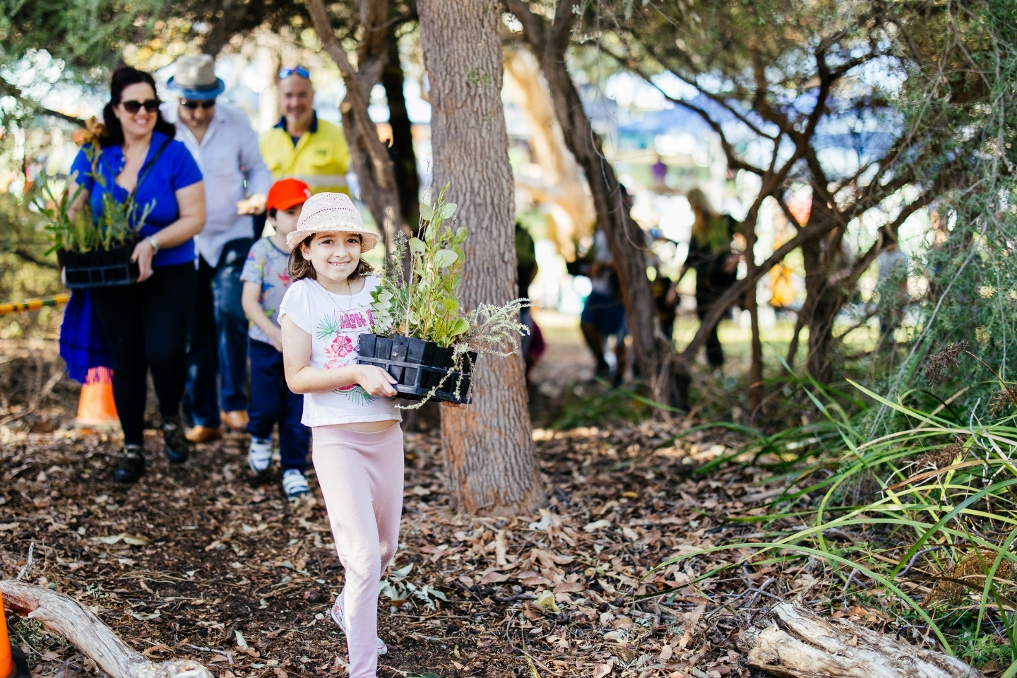 A young girl at a community tree planting day