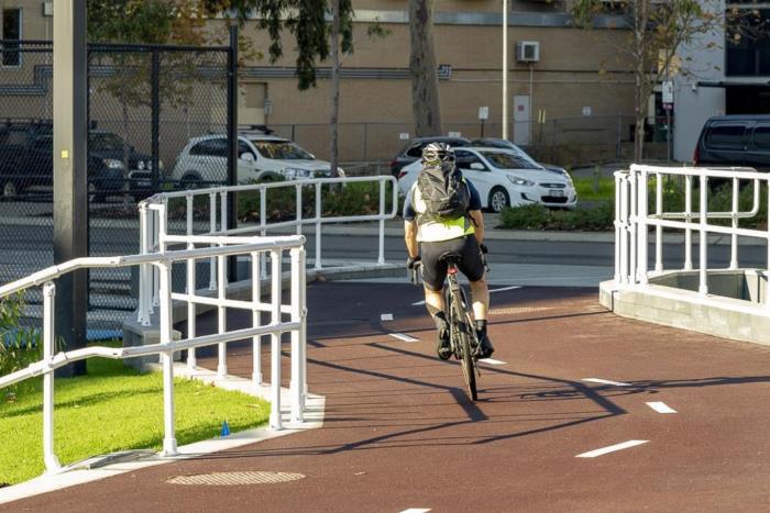 Cyclist on a bike path near RAC Arena