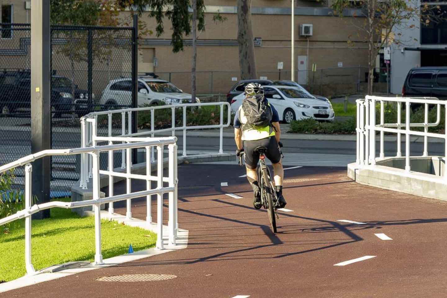 Cyclist on a bike path near RAC Arena