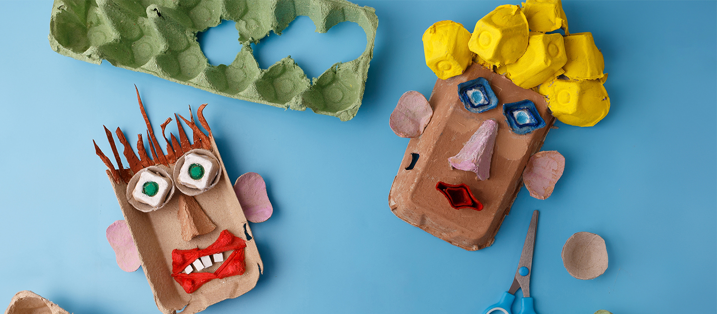 Handmade face puppets made from egg cartons.