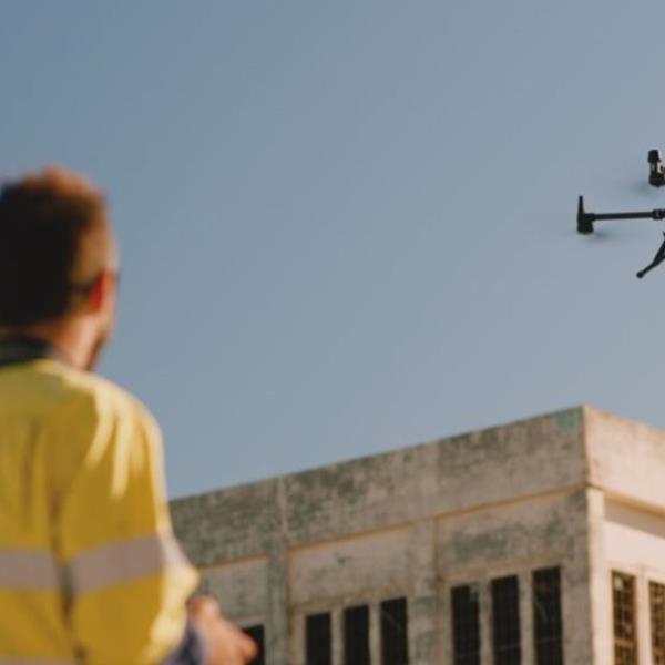 Drone operator and drone outside East Perth Power Station.