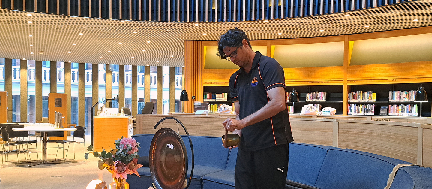 Olman Walley setting up for a sound Meditation session at the Library.