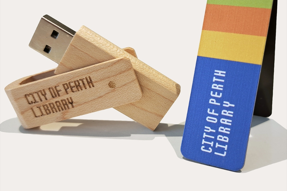 A City of Perth Library branded USB and bookmark
