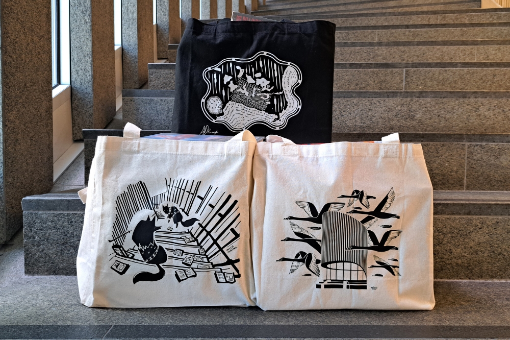 Three library bags featuring images celebrating the Library's 10th anniversary.