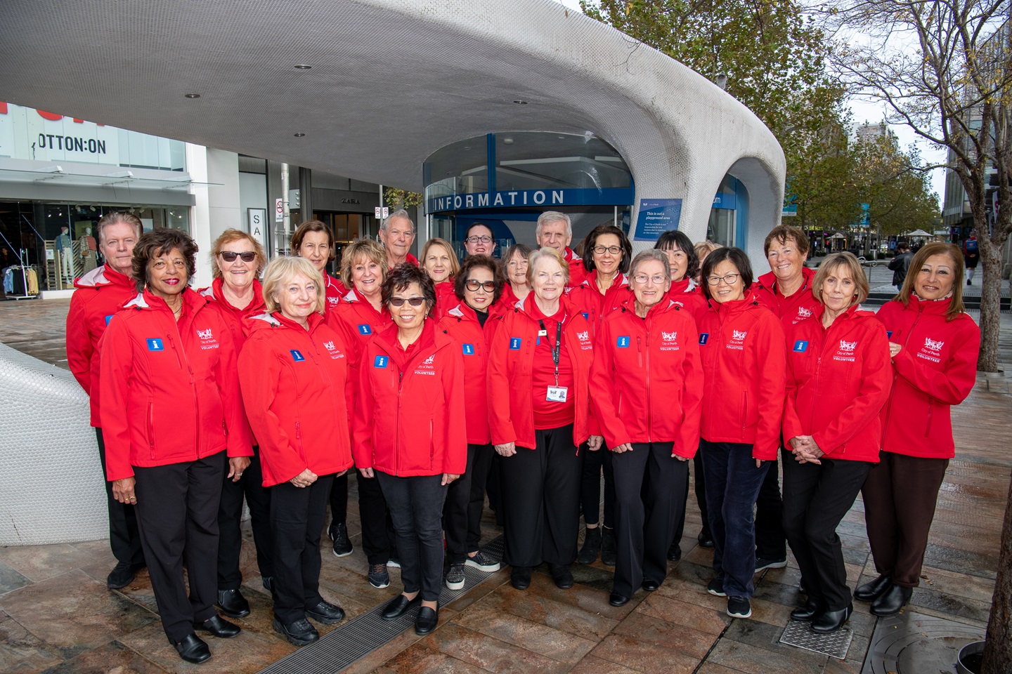 iCity kiosk volunteers smile for the camera