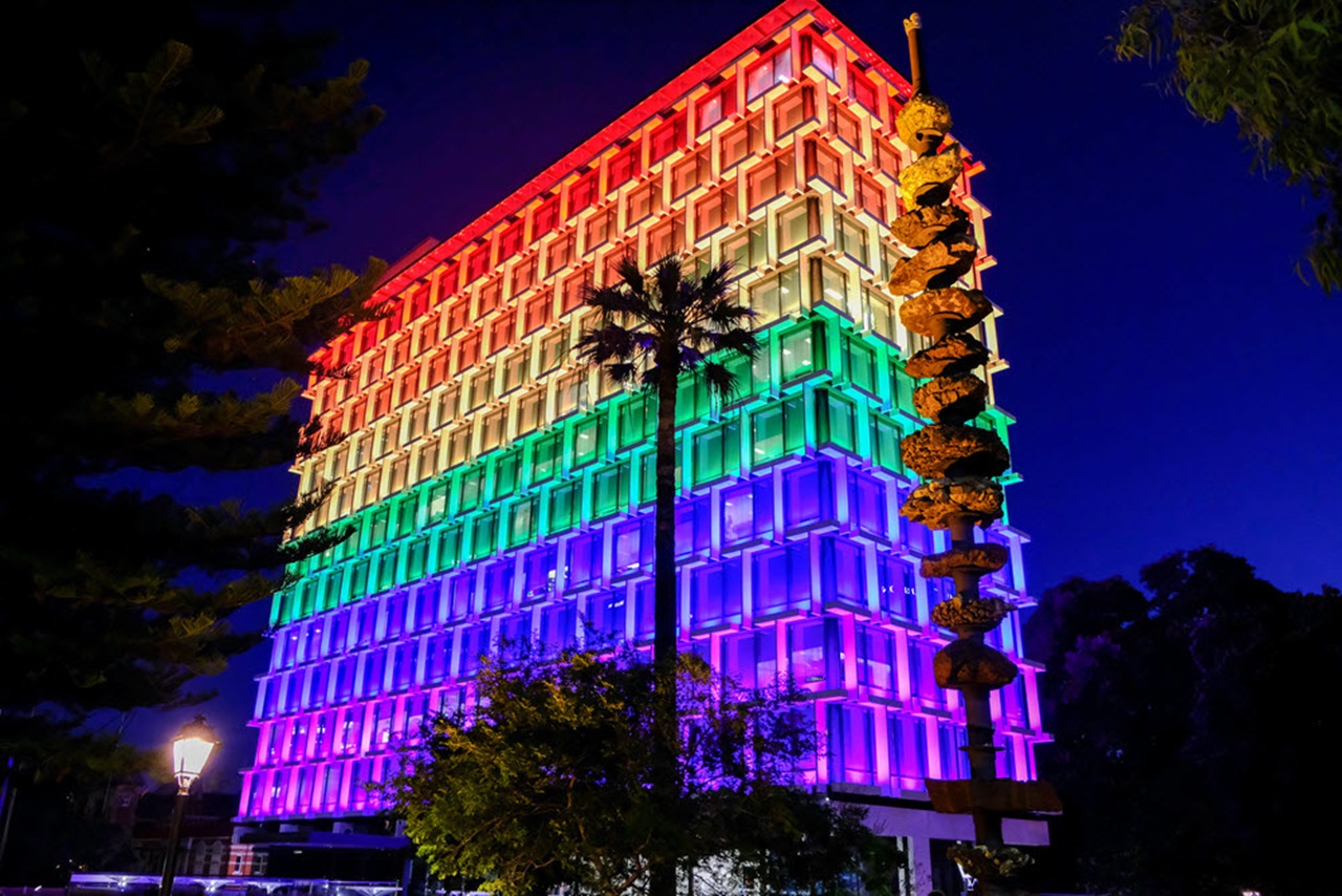 Council House building lit up in rainbow pride colours