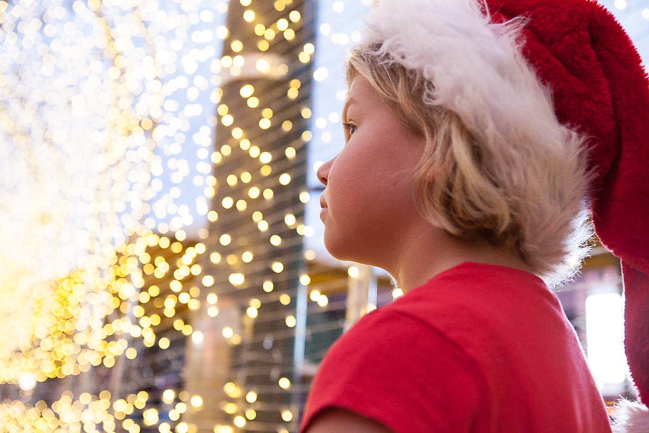 Child at Christmas Lights Trail installation