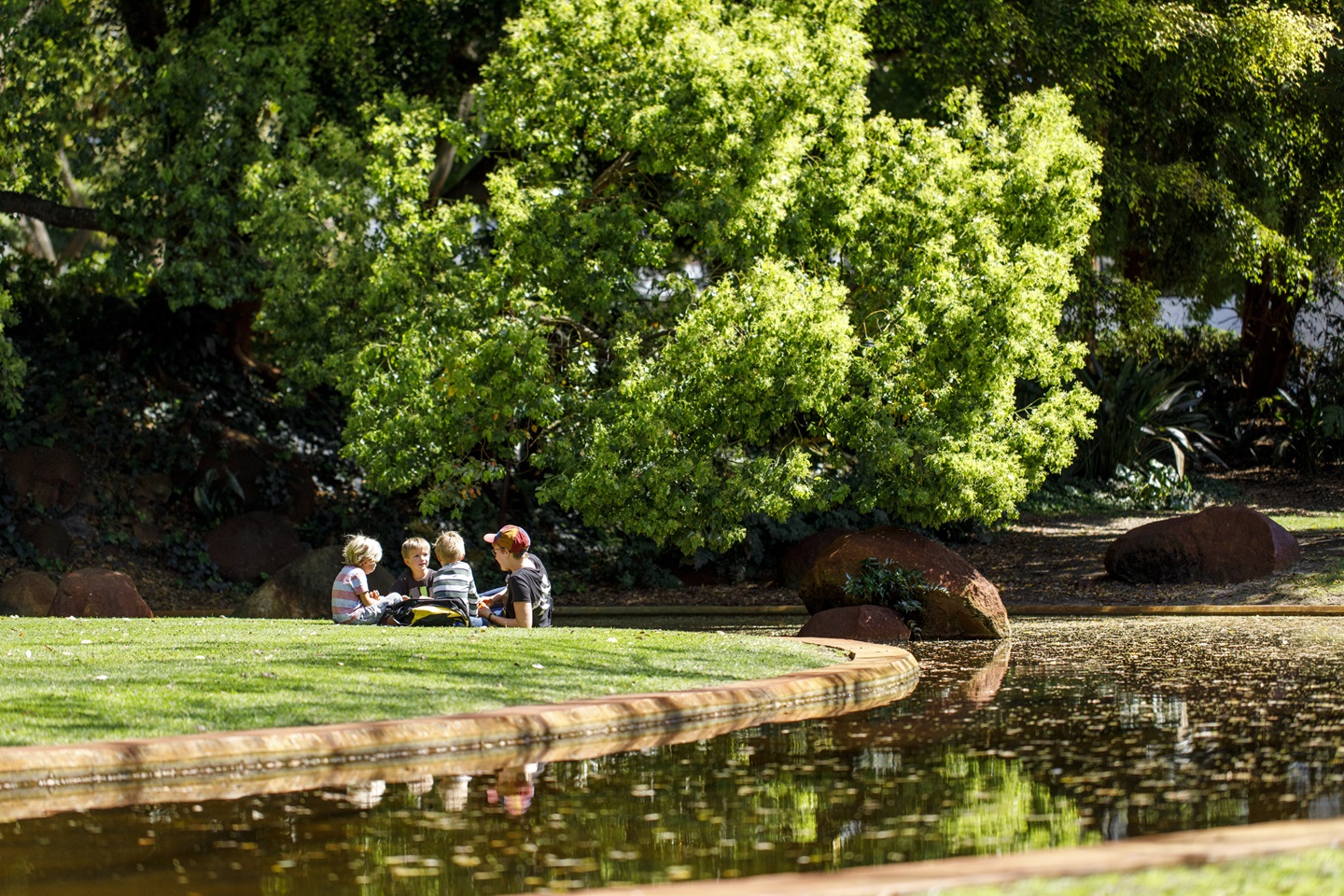 Children next to water at Harold Boas Gardens