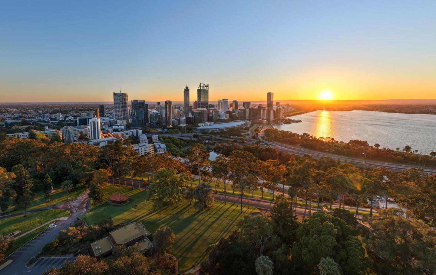 Sun rising over the Swan River with the Perth skyline