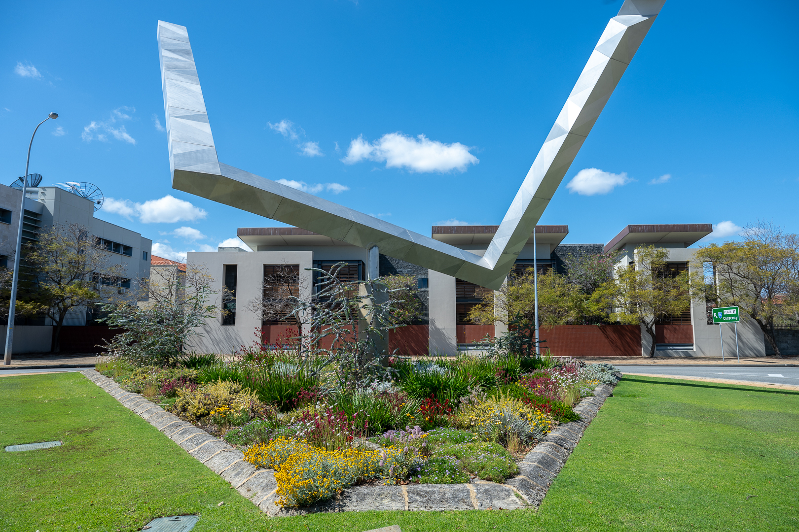Spring plantings at the Impossible Triangle sculpture in East Perth