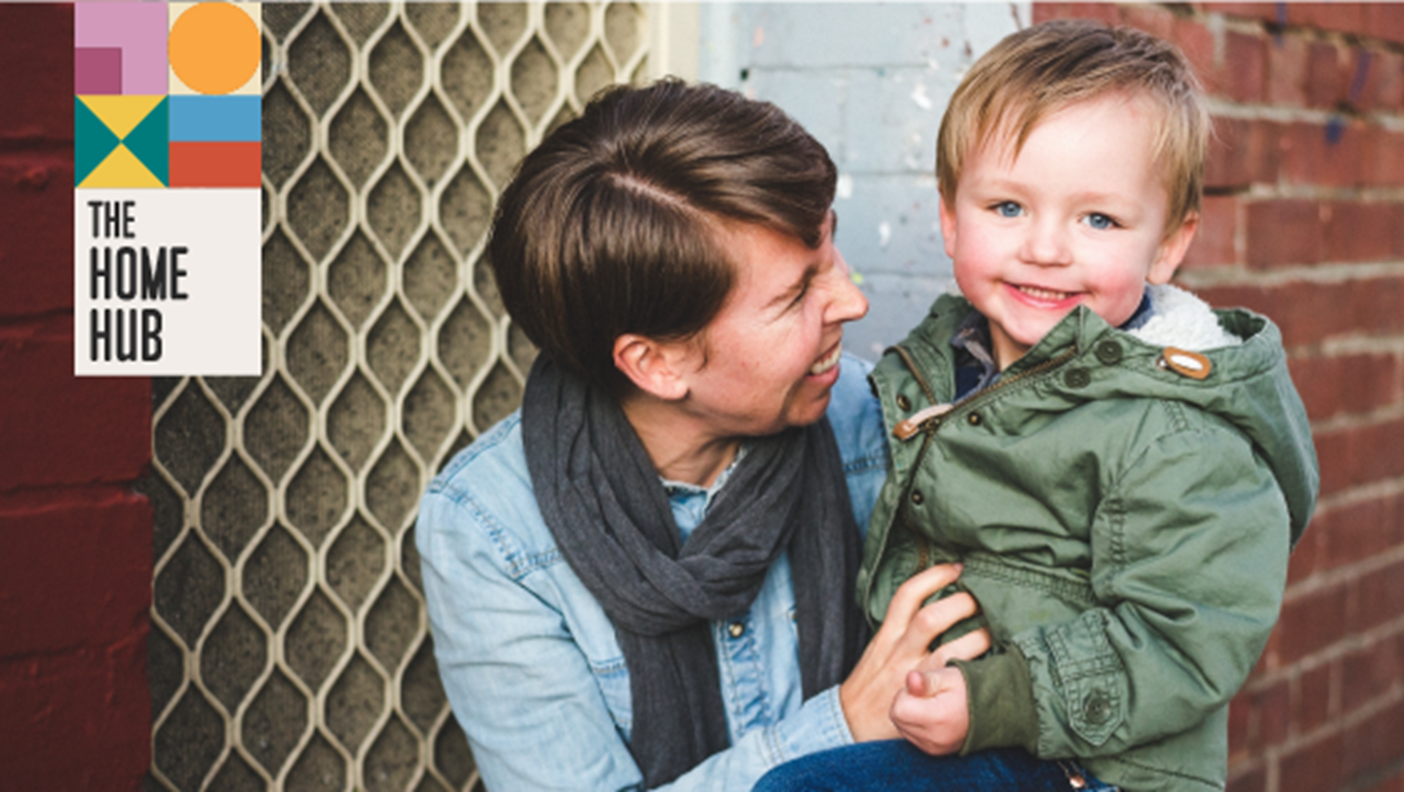 A woman comforts a little boy.