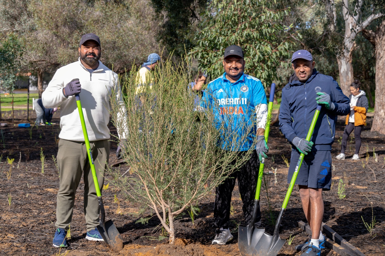 Community members at a tree planting event