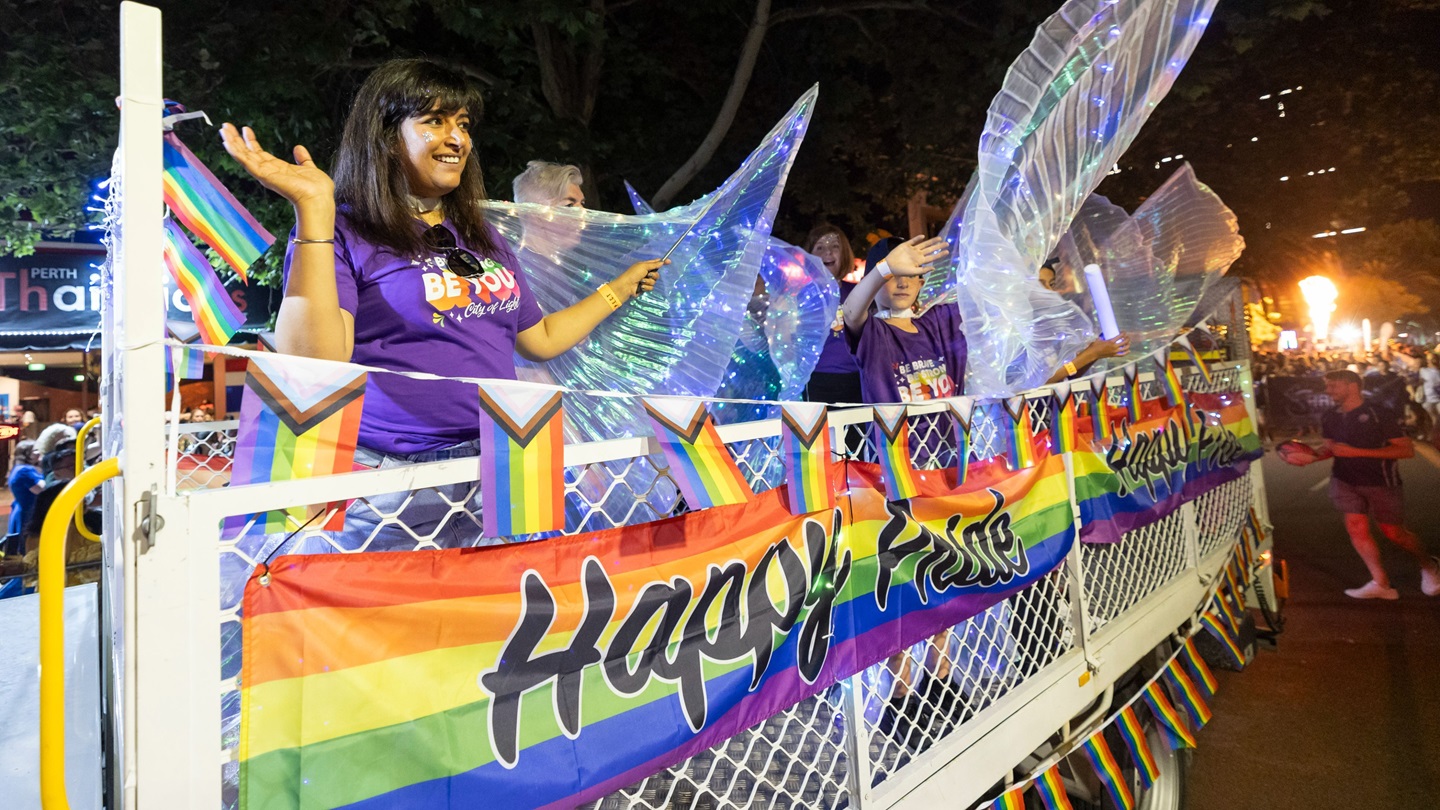 Happy people marching in Pride Parade