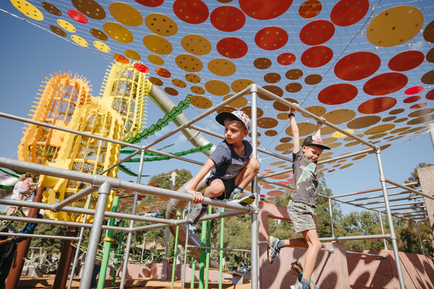 Children on play equipment at Wellington Square