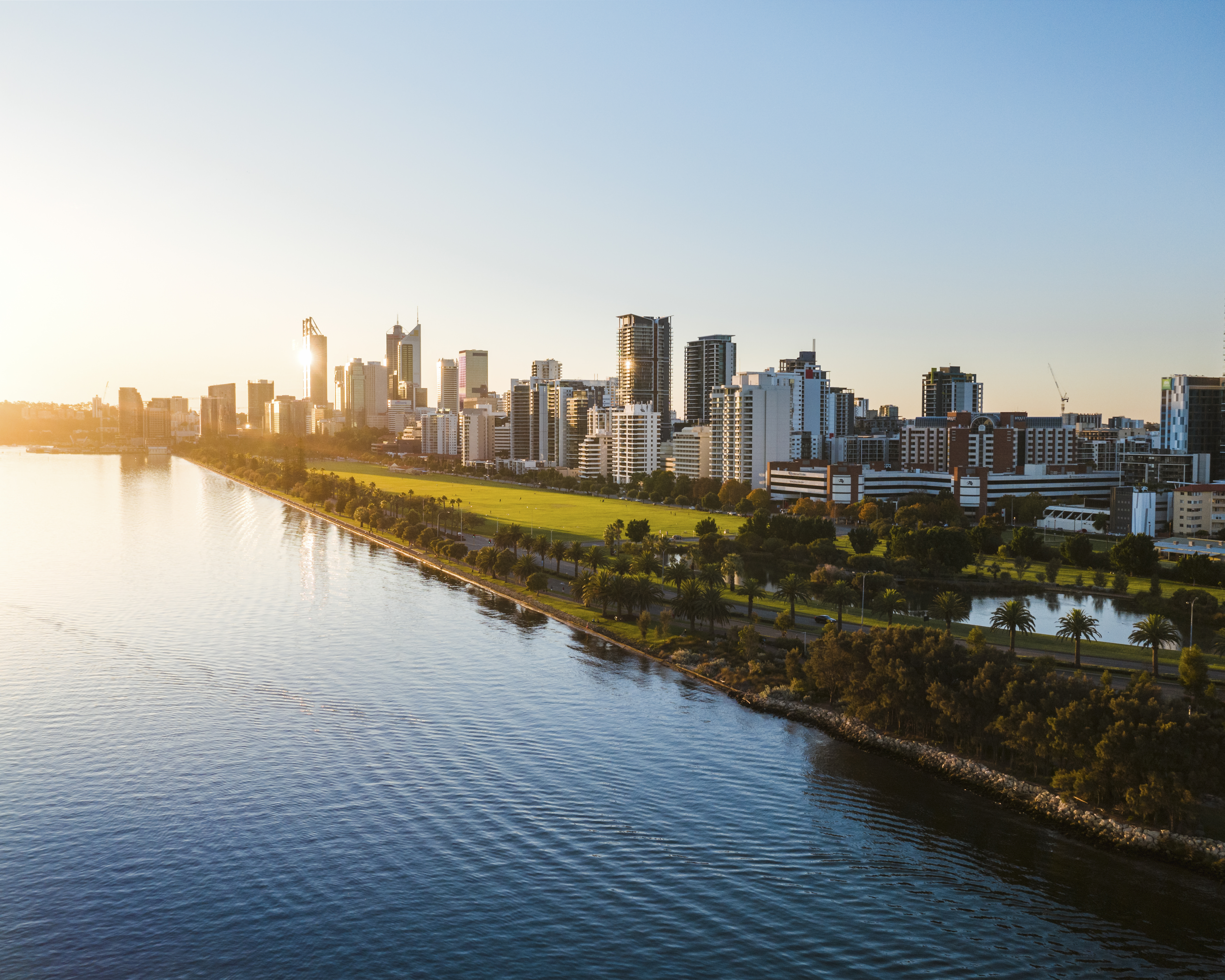 Picture of Langley Park from the sky with Swan River in the foreground and City buildings in the background