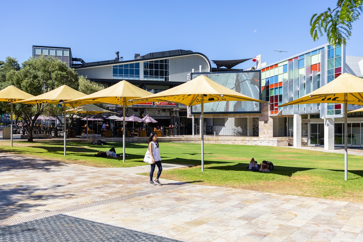 lady walking through Northbridge Piazza