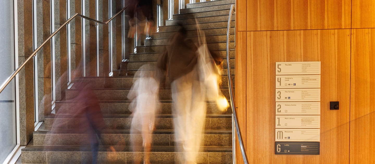 People walking up the stairs in the City of Perth Library