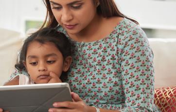 Mother and child watching storytime on tablet