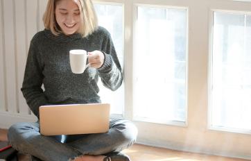 Young woman looking for resources on online catalogues